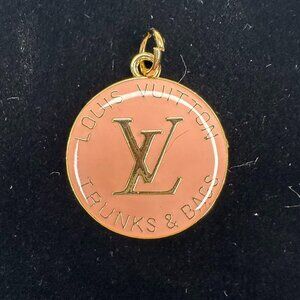 Louis Vuitton "Trunks & Bags" charm, can function as a zipper pull